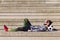 Sportsman resting in a concrete soccer court