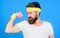 Sportsman retro outfit training blue background. Athlete training with cute dumbbell. Man bearded athlete exercising