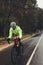 Sportsman riding bicycle on country highway