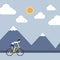 The sportsman is riding bicycle to mountain