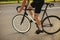 A sportsman riding a bike. Bike details. Active sport activity on open air