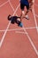 Sportsman running on stadium track