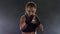 Sportswoman boxer runs towards the camera makes the blows