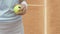 Sportswoman hitting ball up, using professional tennis equipment, close up