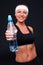 Sportswoman holding bottle of water