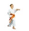 Sportswoman in karategi is beating blow gyaku-tsuki