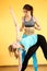 Sportswoman practicing yoga with trainer