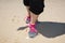 Sportswoman runner getting ready running shoes on sand