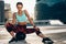 Sportswoman sitting on exercise ball