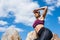 sportswoman sitting on rocks