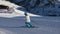 Sportswoman skiing on an empty ski slope