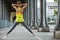 Sportswoman stretching on Pont de Bir-Hakeim bridge in Paris