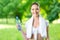 Sportswoman with towel and bottle of water