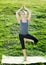 Sportwoman practicing various yoga positions in sunshine outdoor