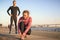 Sporty active couple on a seafront promenade