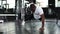 Sporty african man doing push-up in a gym.