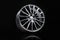 sporty alloy wheels . the rim on a black background. car tuning auto parts