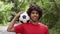 Sporty Black Man Posing With Soccer Ball Smiling Standing Outdoors