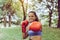 Sporty black woman boxer punching at park,Female boxer eye looking training to you