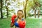 Sporty black woman boxer punching to you at park,Female boxer eye looking training to camera,Happy and smiling,Healthy and lifesty