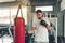 Sporty Boxer is Exercise Punching in Fitness Gym.,Portrait of Boxing Man is Practicing Footwork in Sportswear and Boxing Gloves.,