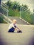 Sporty child kid with his skateboard outdoor.