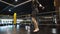 Sporty fit man making jumps in sport club. Male boxer exercising at gym