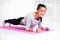 Sporty fit sliming girl doing plank exercise in