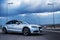 Sporty German Audi sedan on a winding mountain road. Corner view.