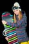 Sporty girl with blue eyes with snowboard on black background in