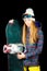 Sporty girl with long blond hair with snowboard on black studio