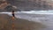 Sporty girl on Playa de Orzola beach in Lanzarote, Canary Islands