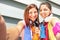 Sporty girlfriends taking selfie during a break at run training