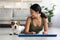 Sporty korean lady enjoying morning yoga with her doggo