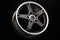 Sporty light black alloy wheel with a white matte rim, close-up