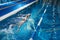 Sporty male swimming in pool, night workout