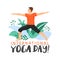 Sporty man practicing virabhadrasana warrior yoga pose. Stylish typography slogan design `international yoga day` sign.