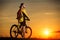 Sporty Man Riding a Bicycle on the Country Road.