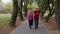 Sporty mature couple family jogging together. Senior husband and wife doing cardio workout exercises