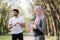 Sporty mulsim woman and man refreshing with water at park