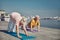 Sporty pensioners working out on the quay