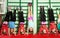 Sporty preteen kids holding handstand in gym