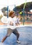 Sporty resolved man playing padel on open court