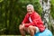 Sporty senior sits on gym ball