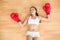 Sporty tired brunette wearing red boxing gloves