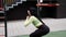 sporty woman in black and green sportswear doing sport exercises outside on sport playground. perfect healthy slim body.