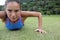 Sporty woman doing push-ups