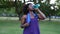 Sporty woman drinking water after exercise