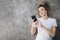 Sporty woman lying in carpet in headphones after training