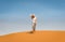 Sporty woman in Merzouga dunes of Sahara desert Morocco